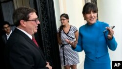 U.S. Commerce Secretary Penny Pritzker, right, talks with Cuba's Foreign Minister Bruno Rodriguez before a meeting in Havana, Cuba, Oct. 7, 2015.