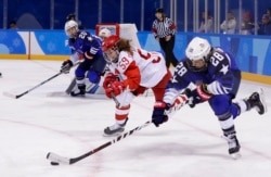 FILE - Amanda Kessel (28), of the United States, drives the puck against Russia's Yelena Dergachyova (59) during the third period of a women's hockey game at the 2018 Winter Olympics in Gangneung, South Korea, Feb. 13, 2018