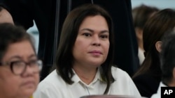 Philippine Vice President Sara Duterte listens as she attends a joint committee hearing of the House of Representatives in Quezon City, Philippines on Nov. 13, 2024.