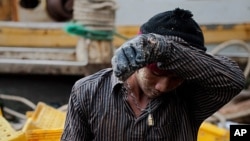 FILE - One of the thousands of men from Myanmar and Cambodia who set sail on Thai fishing boats every day as slaves, forced to work in brutal conditions under threat of death.