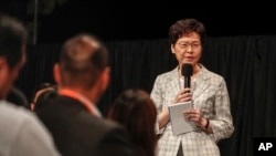 Hong Kong Chief Executive Carrie Lam speaks during a community dialogue with selected participants at the Queen Elizabeth Stadium in Hong Kong, Sept. 26, 2019.