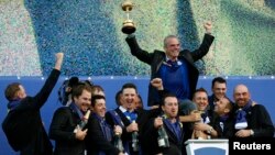 Team Europe captain Paul McGinley (rear) celebrates with players during the closing ceremony of the 40th Ryder Cup at Gleneagles in Scotland Sept. 28, 2014.