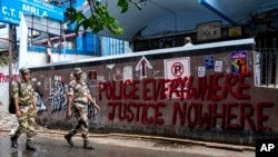 Soldiers of Central Industrial Security Force (CISF), deployed by an order of higher courts, make a routine march inside a government hospital where a rape and murder of a resident doctor occurred in early August, in Kolkata, India, Sept. 4, 2024. 