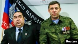 FILE - Alexander Zakharchenko, right, leader of separatist-controlled areas in Ukraine's Donetsk region, and Igor Plotnitsky, leader of separatist-controlled areas in Luhansk region, attend a news conference in Donetsk, Feb. 2, 2015. Zakharchenko announced on Tuesday that a new state should replace all of Ukraine.
