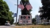 A car passes a yard displaying a campaign sign for Democratic presidential candidate, former Vice President Joe Biden on June 23, 2020 in North Hampton, New Hampshire.