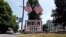 A car passes a yard displaying a campaign sign for Democratic presidential candidate, former Vice President Joe Biden on June 23, 2020 in North Hampton, New Hampshire.