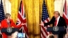 FILE - British Prime Minister Theresa May and U.S. President Donald Trump during their joint news conference at the White House in Washington, Jan. 27, 2017. Both the Trump presidential campaign and the Brexit campaign used Big Data to reach voters.