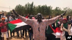 A Sudanese protester shouts slogans during a demonstration against the military council, in Khartoum, Sudan, June 30, 2019. 