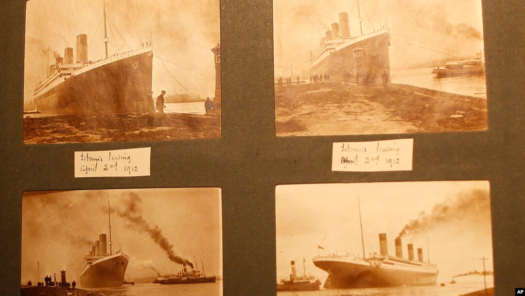 FILE - Photographs of the Titanic are displayed in a family album at the Transport museum in Belfast, Northern Ireland, Oct. 14, 2014.