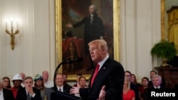 U.S. President Donald Trump speaks during a signing event for an Executive Order that establishes a National Council for the American Worker at the White House in Washington, U.S., July 19, 2018. 