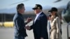 U.S. President Donald Trump, followed by First Lady Melania Trump, shakes hands with California Governor Gavin Newsom upon arrival at Los Angeles International Airport in Los Angeles on Jan. 24, 2025, to visit the region devastated by wildfires.