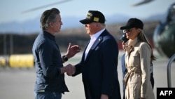 U.S. President Donald Trump, followed by First Lady Melania Trump, shakes hands with California Governor Gavin Newsom upon arrival at Los Angeles International Airport in Los Angeles on Jan. 24, 2025, to visit the region devastated by wildfires.