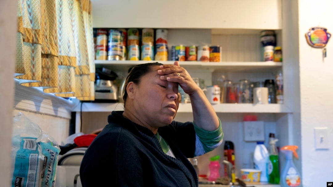 A volunteer prepares bags with groceries for delivery at The Campaign Against Hunger food pantry, April 16, 2020, in the Bedford-Stuyvesant neighborhood of the Brooklyn borough of New York