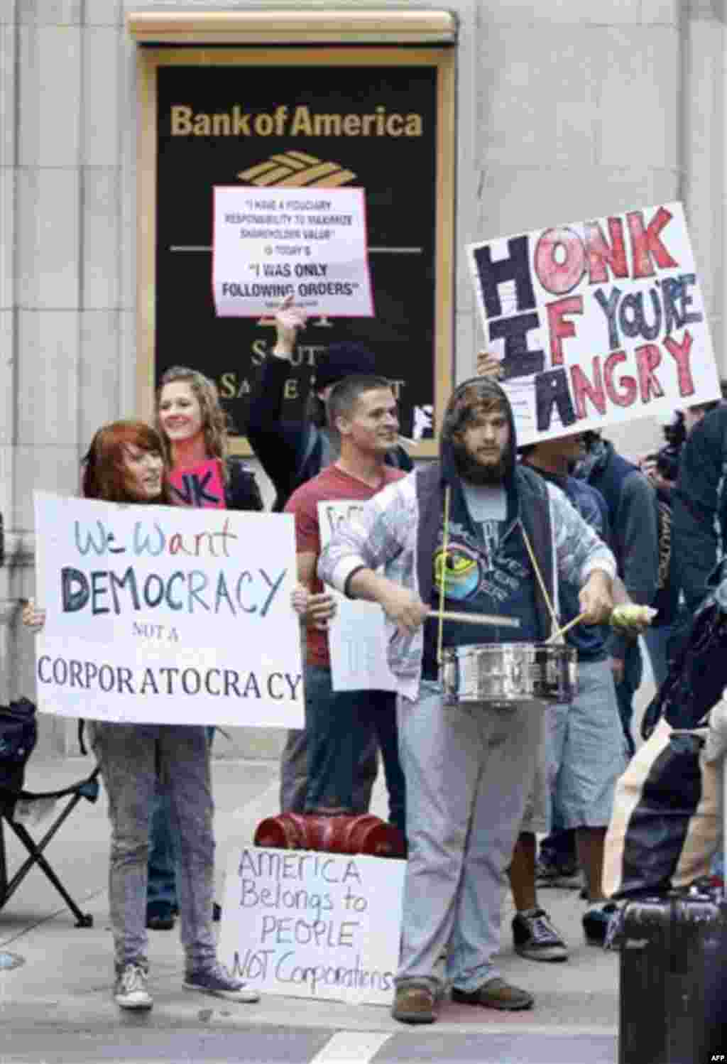 Protesters gather on the corner of LaSalle and Jackson during an Occupy Chicago protest Monday, Oct. 3, 2011, in Chicago. "Occupy Chicago" protests started Monday near the Federal Reserve Bank and Chicago Board of Trade, as demonstrators speak out agains