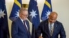 Perdana Menteri Australia Anthony Albanese menyaksikan Presiden Nauru David Adeang, (kanan), menandatangani buku tamu Gedung Parlemen Australia di Canberra, Senin, 9 Desember 2024. (Dominic Giannini/AAP Image via AP)