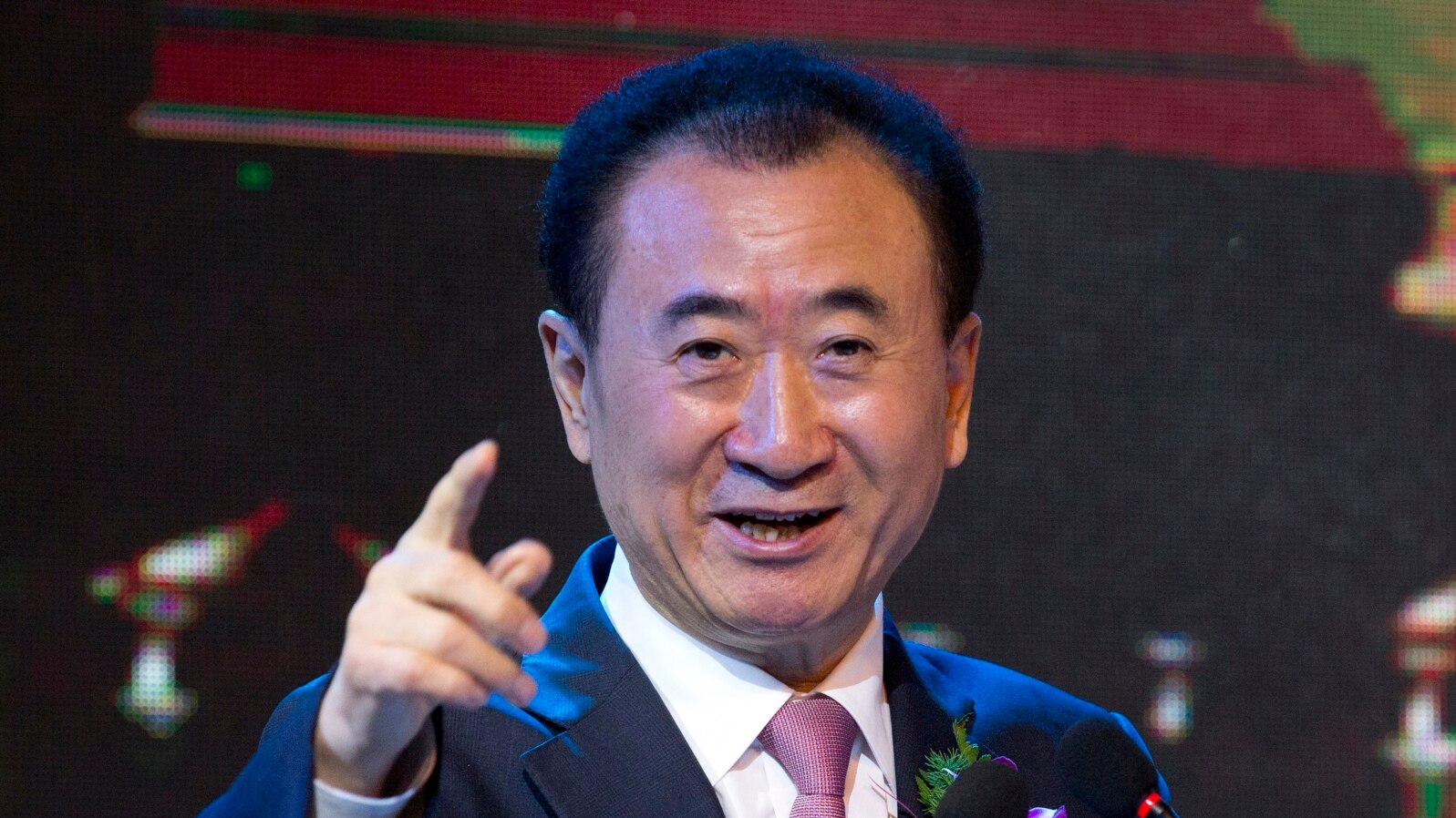  FILE - Wang Jianlin, chairman of Wanda Group, speaks during a signing ceremony for a strategic partnership between FIBA and Wanda Group in Beijing, June 16, 2016. Wang has threatened to withdraw his $10 billion in U.S. investments if Washington imposes curbs on Chinese businesses.