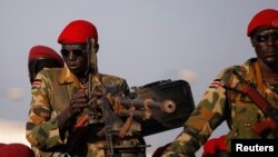 SPLA soldiers stand in a vehicle in Juba December 20, 2013. Talks between South Sudan's President Salva Kiir and African mediators trying to broker a peace deal after six days of clashes between rival army factions are progressing well, Ethiopia's foreign