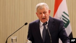 FILE - Iraqi President Abdul Latif Rashid talks to the media during a press conference at the Presidential palace in capital Nicosia, Cyprus, Dec. 11, 2023. 