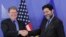 EU chief negotiator Ignacio Garcia Bercero, right, shakes hands with U.S. Assistant Trade Representative for Europe and the Middle East, Daniel Mullaney, Brussels, Nov. 11, 2013.