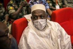 Former Defense Minister Bah N'Daw waits to be sworn into the office of transitional president at a ceremony in Bamako, Mali, Sept. 25, 2020. Mali's transitional president and vice president were sworn into office more than a month after a coup in the West African nation.