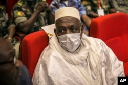 Former Defense Minister Bah N'Daw waits to be sworn into the office of transitional president at a ceremony in Bamako, Mali, Sept. 25, 2020. Mali's transitional president and vice president were sworn into office more than a month after a coup in the West African nation.