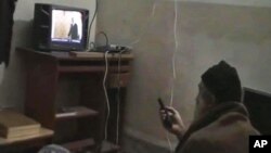 FILE - This undated image from video, seized from the walled compound of al-Qaida leader Osama bin Laden in Abbottabad, Pakistan, and released by the U.S. Department of Defense, May 7, 2011, shows a man, identified as Osama bin Laden, watching then-president Barack Obama on his television.