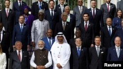 World leaders in attendance of the U.N.'s COP28 climate summit in Dubai pose for a family photo, Dubai, United Arab Emirates, December 1, 2023.