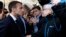 French President Emmanuel Macron argues with a resident as he arrives for a meeting at the city hall in Charleville-Mezieres, eastern France, Nov. 7, 2018 as part of a World War One commemoration tour.