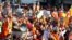 Sri Lankan Buddhist monks shout slogans and hold placards as they stage a protest rally outside the Bangladesh High Commission in Colombo on October 4, 2012.