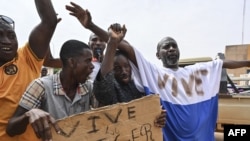 FILE - Supporters of Niger's National Council for the Safeguard of the Homeland (CNSP) demonstrate in Niamey on August 6, 2023.