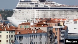 (File) The MSC Musica cruise ship in the Venice lagoon. Italy will now limit or ban cruise ship traffic in parts of the Venice lagoon and near Saint Mark's Square. 