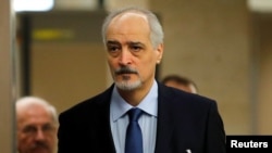 Syria's U.N. ambassador and chief negotiator Bashar al-Ja'afari arrives for a meeting with United Nations Special Envoy for Syria Staffan de Mistura during the Intra Syria talks in Geneva, Switzerland, Dec.1, 2017.