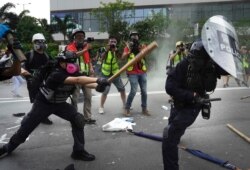 Police and demonstrators clash in Hong Kong, Aug. 24, 2019. The city's pro-democracy protesters took to the streets again, this time to call for the removal of "smart lampposts" that raised fears of stepped-up surveillance.