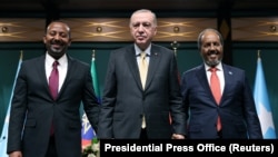 FILE - Turkish President Recep Tayyip Erdogan poses with Somali President Hassan Sheikh Mohamud and Ethiopian Prime Minister Abiy Ahmed in Ankara, Turkey, on Dec. 11, 2024. Mohamud made a visit to Ahmed in Ethiopia on Jan. 11, 2025. (Presidential Press Office via Reuters)