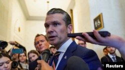 FILE PHOTO: Meeting with Pete Hegseth, President-elect Donald Trump's nominee for defense secretary on Capitol Hill in Washington