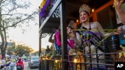 Louisiana festival queens from across the state ride in a float during the Krewe of Bacchus parade in New Orleans, March 2, 2025.