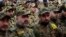 FILE - Hezbollah fighters listen to Hezbollah leader Sheik Hassan Nasrallah, as he speaks via video link during a rally to mark the Hezbollah martyr day, in the southern suburb of Beirut, Lebanon, Beirut, Lebanon, Wednesday, Nov. 11, 2015. 