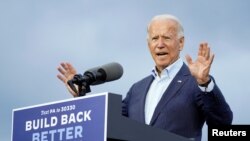 FILE - Democratic presidential candidate Joe Biden speaks during a campaign event at United Association Plumbers Local 27 in Erie, PA, Oct. 10, 2020.