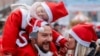 Participants wearing Santa Claus-themed outfits take part in a charity run, in Pristina, Kosovo, Dec. 15, 2024. 