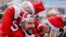 Participants wearing Santa Claus-themed outfits take part in a charity run, in Pristina, Kosovo, Dec. 15, 2024. 
