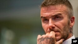 FILE - David Beckham listens during a public hearing for his proposed Major League Soccer stadium and commercial development, at City Hall in Miami, Florida, July 12, 2018. 