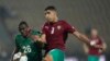 Morocco's Adam Masina, right, kicks the ball as he defends against Malawi's Stain Davie, during the African Cup of Nations 2022 round of 16 soccer match between Morocco and Malawi at the Ahmadou Ahidjo stadium in Yaounde, Cameroon, Jan. 25, 2022. 