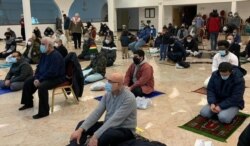 Men praying at the Worcester Islamic Center, Worcester, Massachusetts. (Courtesy Worcester Islamic Center)