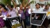 FILE - Sri Lankan women shout slogans during a protest in Colombo, Sri Lanka, Jan. 11, 2013, condemning the execution of Sri Lankan domestic worker Rizana Nafeek in Saudi Arabia. Saudi authorities said Rizana Nafeek has been executed for killing a Saudi baby in her care in 2005.
