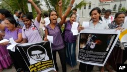 FILE - Sri Lankan women shout slogans during a protest in Colombo, Sri Lanka, Jan. 11, 2013, condemning the execution of Sri Lankan domestic worker Rizana Nafeek in Saudi Arabia. Saudi authorities said Rizana Nafeek has been executed for killing a Saudi baby in her care in 2005.