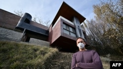 Architect Michael Kovac stands outside his house, which survived the Palisades Fire due to fire-resilient features used in its construction, in Los Angeles on Jan. 22, 2025.