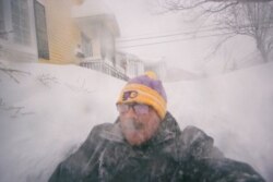 A man is pictured in a snowy street in St. John's, Newfoundland and Labrador, Canada, Jan. 17, 2020.
