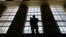 A guard stands watch over the east block of death row at San Quentin State Prison, Aug. 16, 2016, in San Quentin, Calif. 