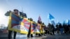 Aksi protes aktivis Tibet dan Uighur di luar Kantor PBB di Jenewa saat peninjauan catatan hak asasi manusia China oleh Dewan Hak Asasi Manusia PBB, 23 Januari 2024.