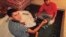 In this undated photo, published Tuesday Aug. 6, 2018 by the Spanish newspaper La Vanguardia, terrorists identified as Younes Abouyaaqoub, left and Youssef Aalla, prepare explosives at a house in Alcanar, Spain. 